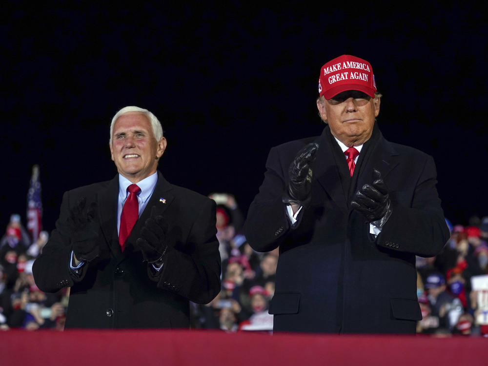 In this file photo, then-President Donald Trump arrives for a campaign rally at Gerald R. Ford International Airport, Nov. 2, 2020, in Grand Rapids, Mich., with then-Vice President Mike Pence. Despite running with him twice, in 2016 and in 2020, Pence will not endorse Trump in 2024.