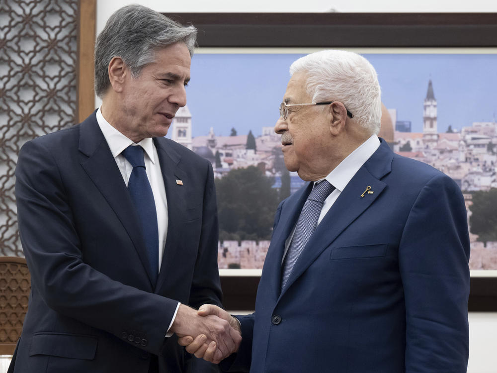 Palestinian Authority President Mahmoud Abbas (right) and U.S. Secretary of State Antony Blinken shake hands prior to a meeting at the presidential compound in the West Bank city of Ramallah on Nov. 30, 2023.
