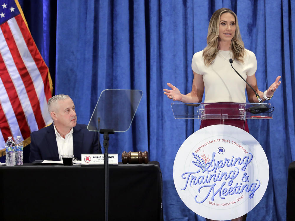 Lara Trump, the newly elected Republican National Committee co-chair, right, gives an address as newly elected Chair Michael Whatley listens RNC meetings March 8 in Houston.