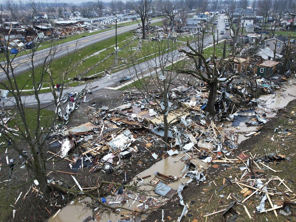 Debris scatters the ground on Friday near damaged homes following a severe storm in Lakeview, Ohio.