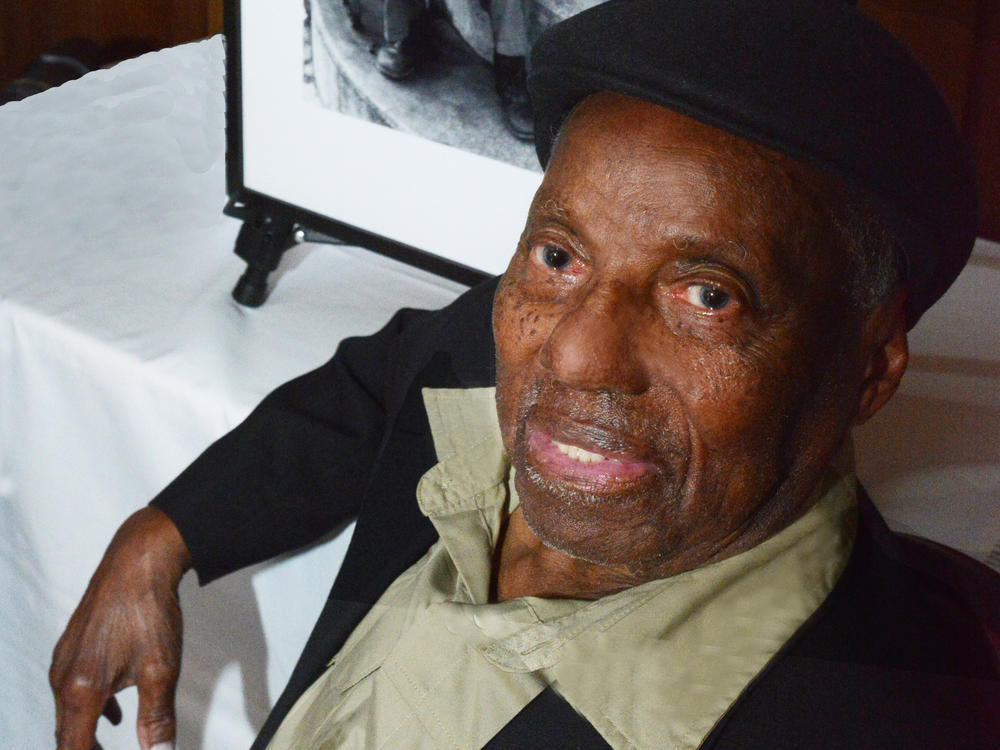 David Johnson in 2023 with one of his photographs, 
