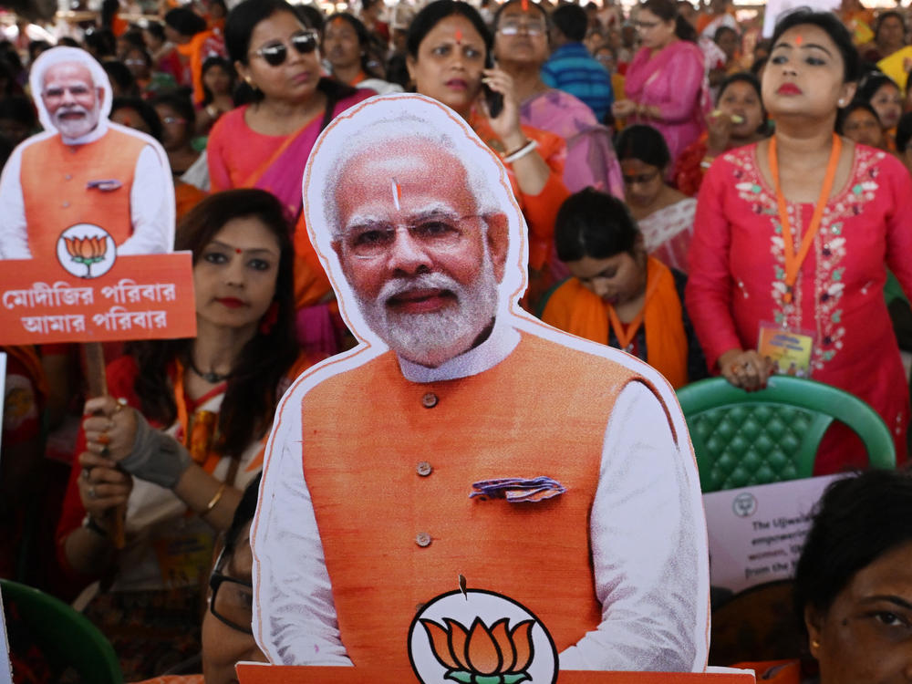 Bhartiya Janata Party (BJP) supporters hold cutout pictures of Indian Prime Minister Narendra Modi during a public meeting in Barasat on the outskirts of Kolkata on March 6. In India, Modi's face is everywhere as the country heads to elections.
