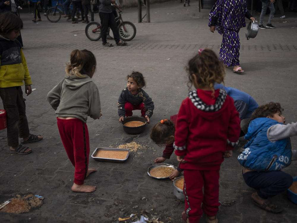 Palestinian children receive free food in Rafah, Gaza Strip, on Feb. 23. More than a million Palestinians displaced by the war have taken refuge in Rafah governorate, including an estimated 600,000 children.