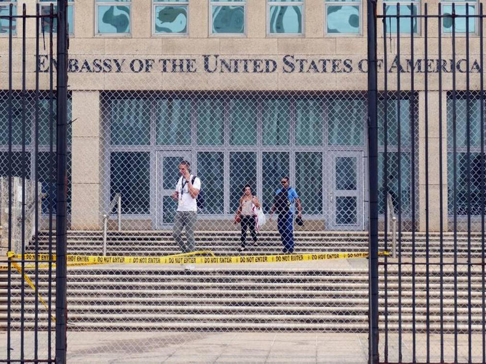 Workers at the U.S. Embassy in Havana leave the building in September 2017. New research out of the National Institutes of Health finds no unusual pattern of damage in the brains of Havana syndrome patients.
