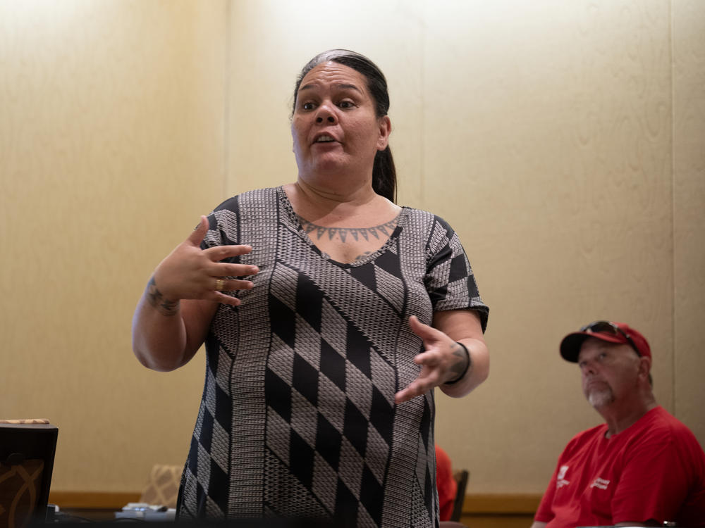 Mehana Hind is a cultural liaison with the Council for Native Hawaiian Advancement. She is speaking to members of the U.S. Army Corps of Engineers, newly arrived from the mainland to work on the cleanup of the deadly wildfires that swept Lahaina on Maui last summer.