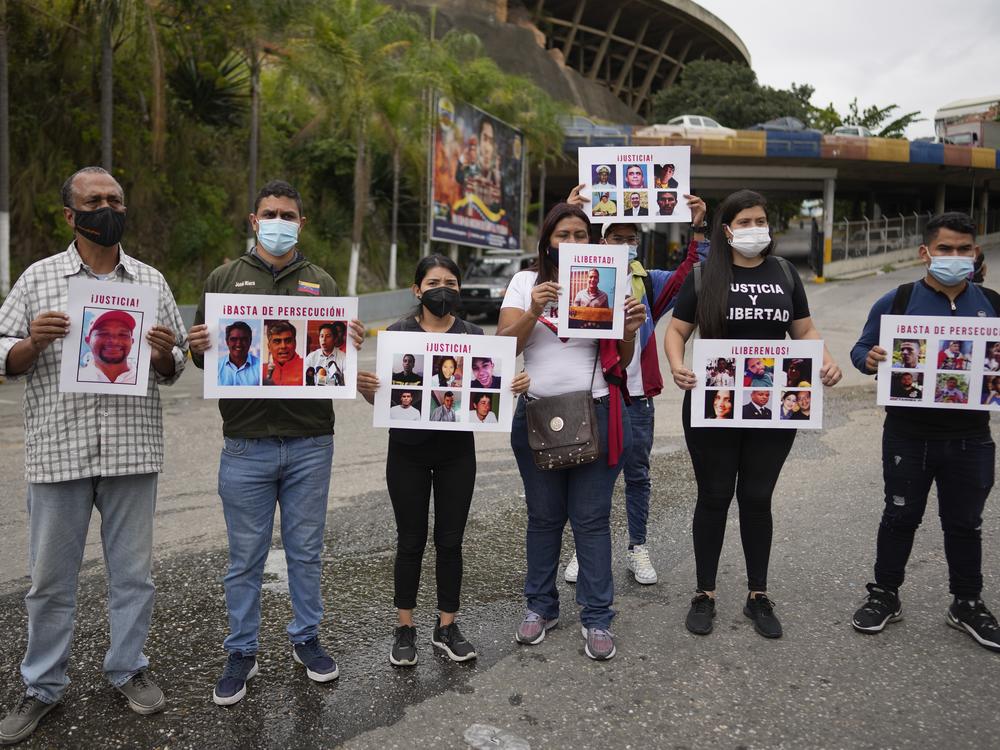 Andreina Baduel (second from right) joins others to protest against the taking of what they call political prisoners outside the Bolivarian National Intelligence Service building known as El Helicoide, in Caracas, Venezuela, Nov 3, 2021. Baduel is the daughter of former Defense Minister Raúl Isaías Baduel, who died in prison in 2021.