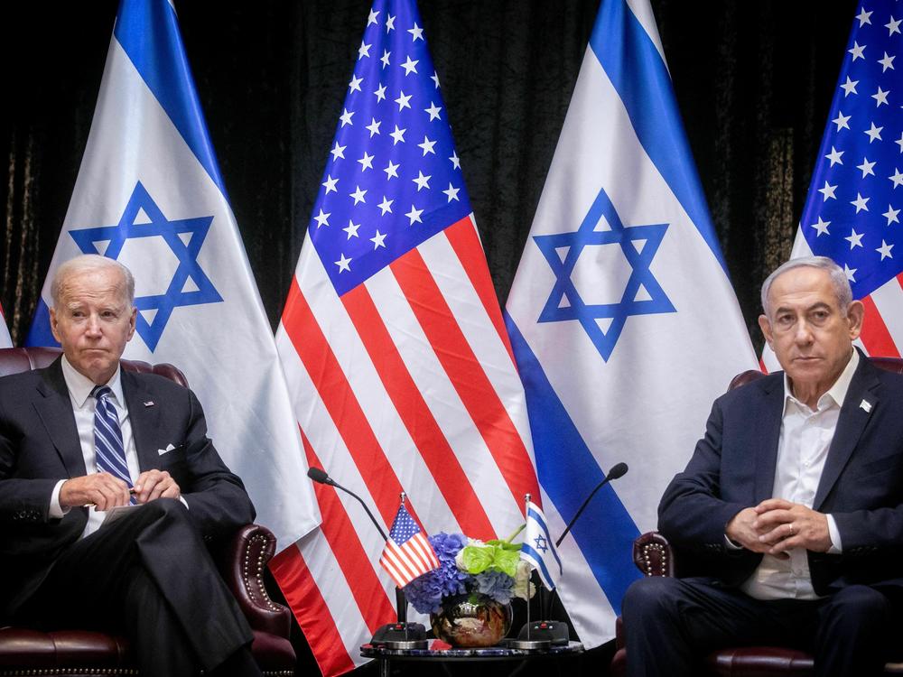 President Biden sits with Israeli Prime Minister Benjamin Netanyahu, at the start of the Israeli war cabinet meeting, in Tel Aviv on Oct. 18, 2023.