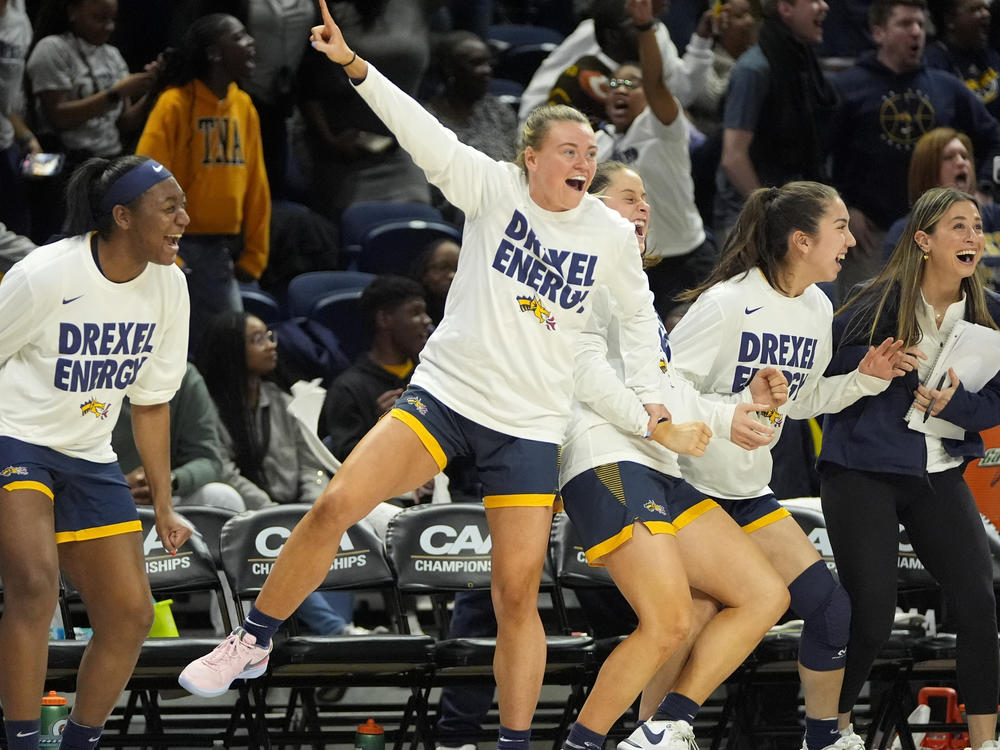 Members of the Drexel team celebrate during a game against Stony Brook in the championship of the Colonial Athletic Association conference women's tournament, Sunday, March 17, 2024. Drexel won and qualified for the NCAA women's basketball tournament - and will now face No. 1 bracket seed Texas.