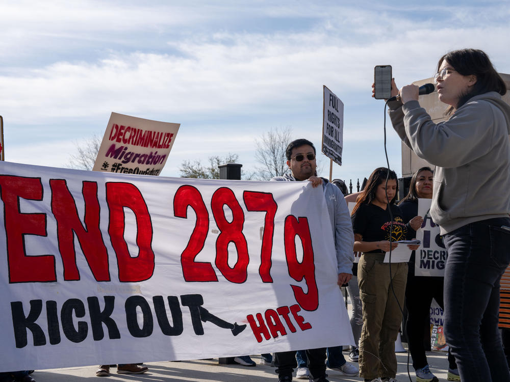 A coalition of immigrant advocacy groups hold a rally outside of the Georgia State Capitol in protest of HB 1105, a bill which would require local law enforcement to take on responsibilities of immigration and customs enforcements agents as part of a federal program known as 287g.