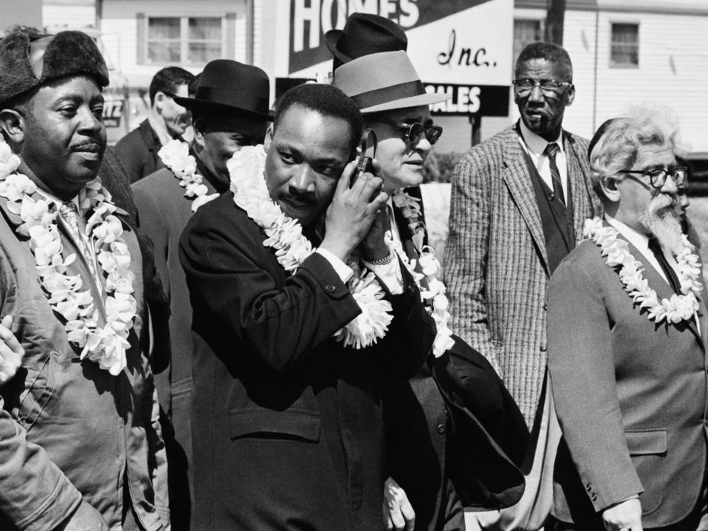 Civil rights activist Martin Luther King Jr marching from Selma to Montgomery, Alabama alongside Rabbi Abraham Joshua Heschel.