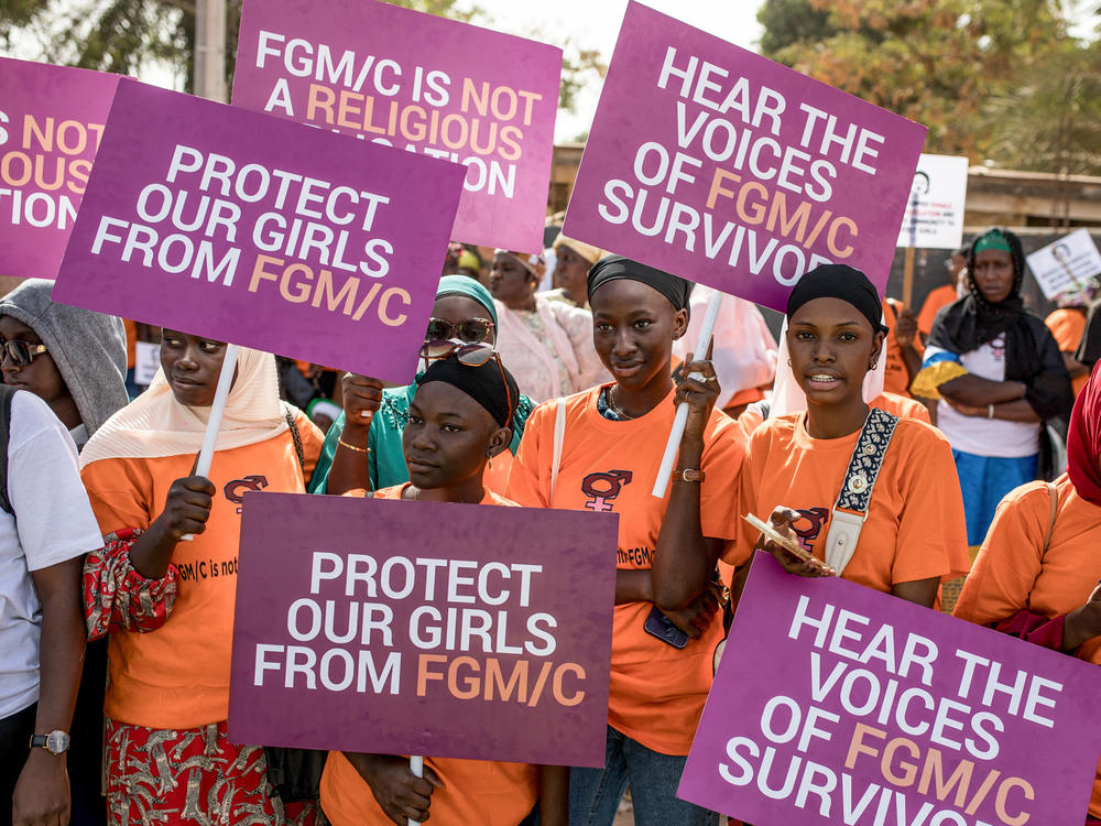 The debate over FGM has divided The Gambia for months, with hundreds gathering to protest outside parliament. Here, anti-FGM protestors demonstrate at the National Assembly session on March 18.