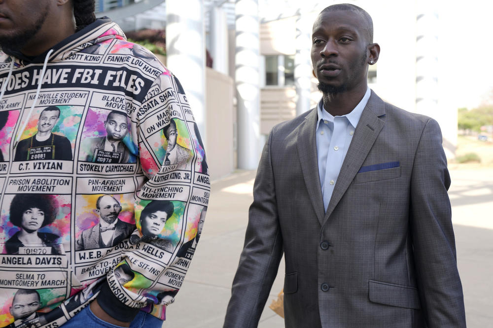 Michael Corey Jenkins, right, follows a friend as he enters the federal courthouse in Jackson, Miss., Wednesday, for sentencing on the third of the six former Rankin County law enforcement officers who committed racially motivated, violent torture on him and his friend Eddie Terrell Parker in 2023. The six former law officers pleaded guilty to torturing them.