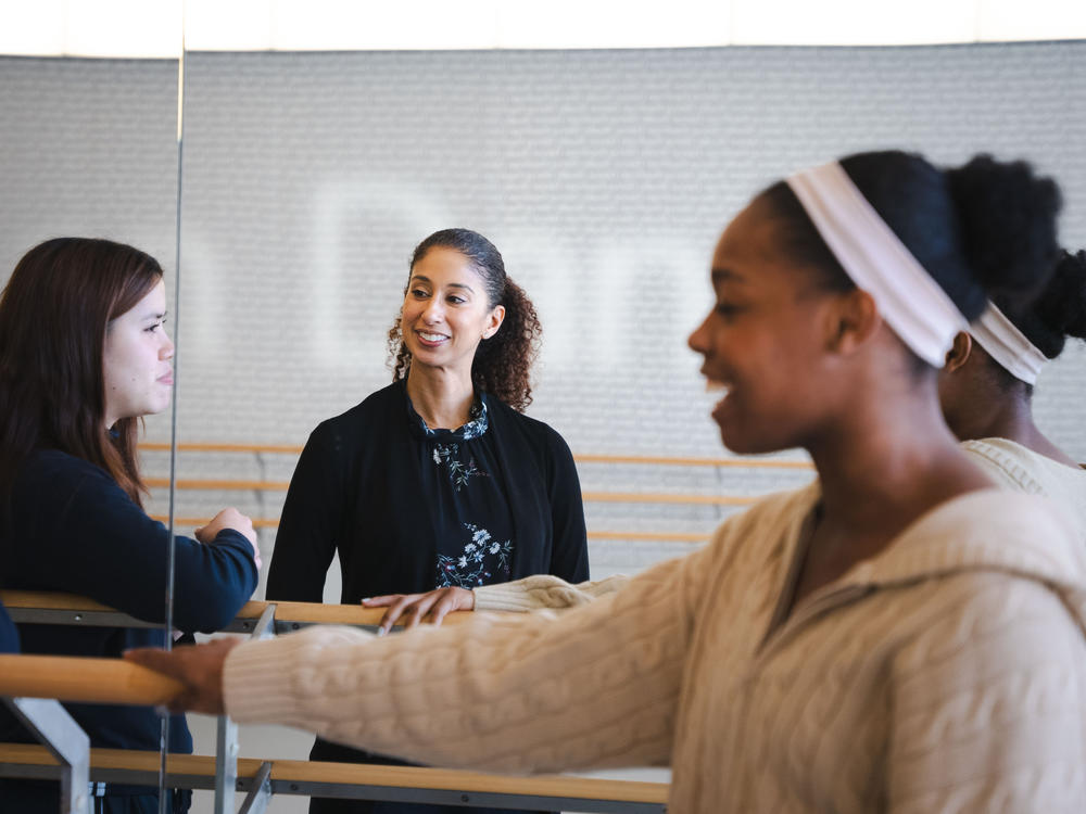 Alicia Graf Mack, dean and director of The Juilliard School's Dance Division (center), speaks with fourth-year dance students Kailei Sin (left) and Nyoka Wotorson (right) in between classes.