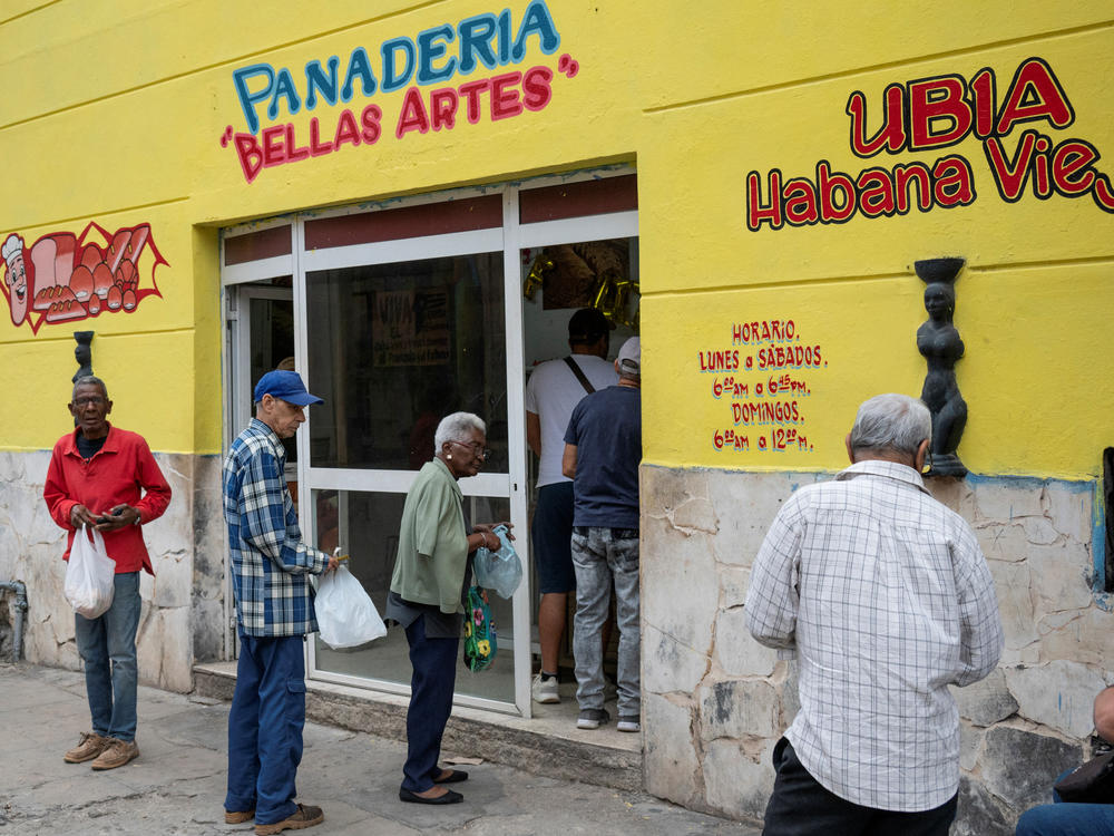 Older people line up to buy bread at a bakery in Havana on March 8.