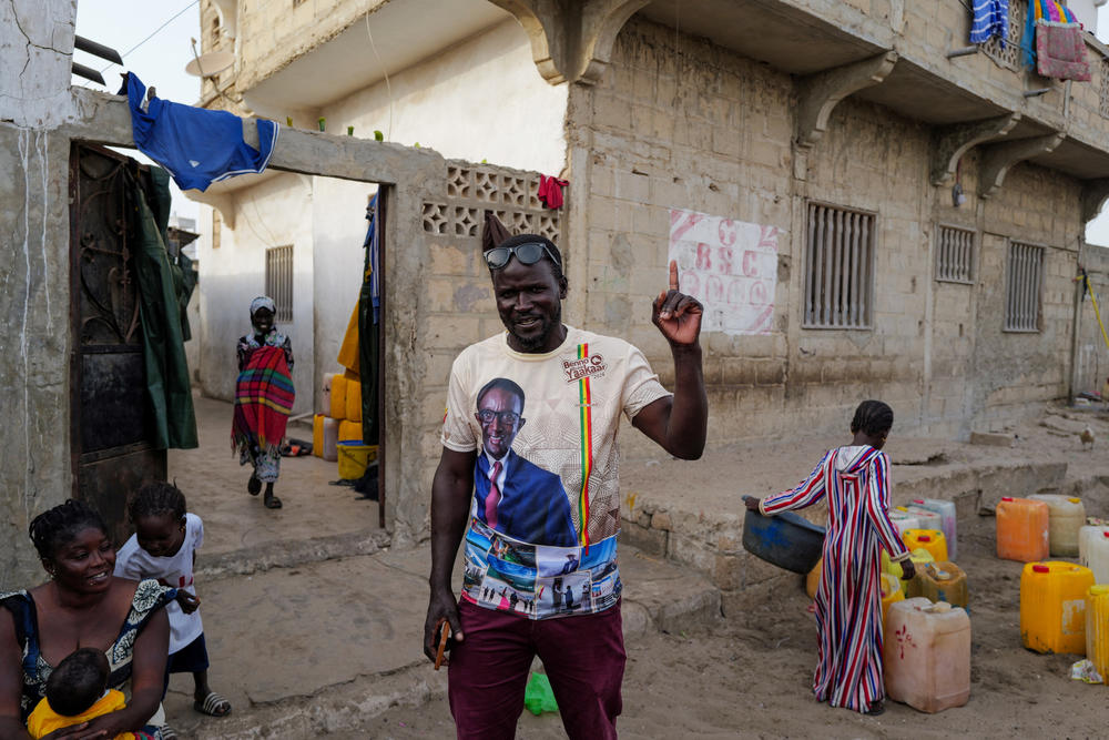 A supporter of Senegalese presidential candidate, Amadou Ba of Senegalese President Macky Sall's ruling coalition, reacts as he wear a T-shirt depicting Ba in Fass Boye, Senegal March 20, 2024.