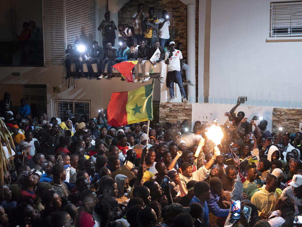 Supporters celebrate the release of Senegal's top opposition leader Ousmane Sonko and his key ally Bassirou Diomaye Faye outside Sonko's home in Dakar, Senegal, Thursday, March 14, 2024.