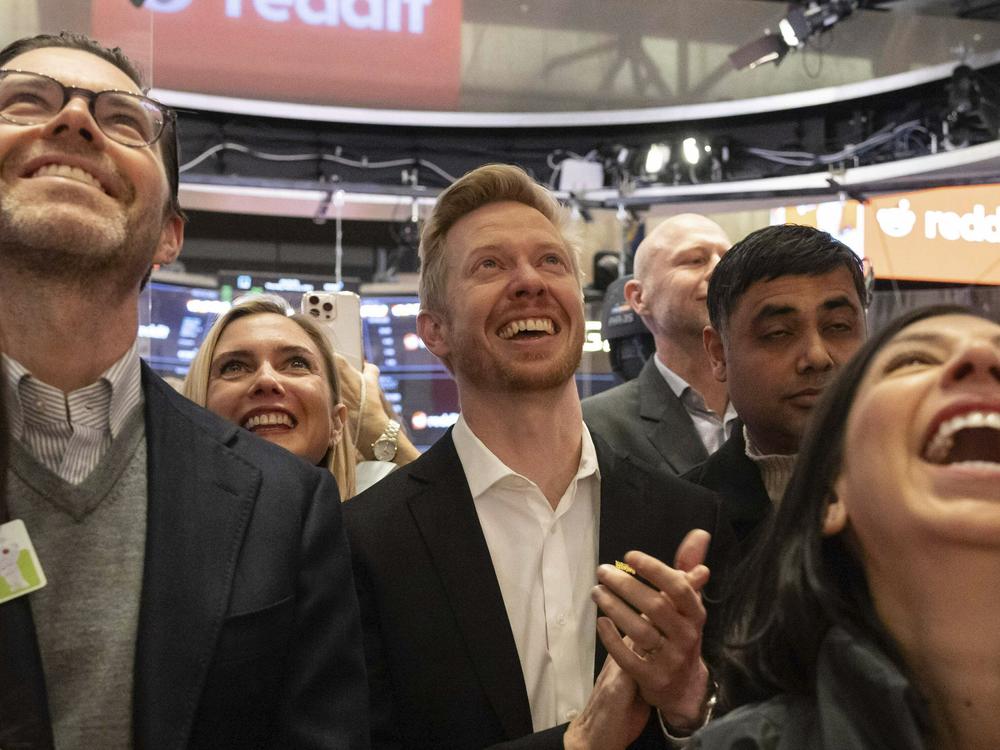Reddit CEO Steve Huffman and company employees celebrate on the New York Stock Exchange trading floor, prior to his company's IPO, Thursday.