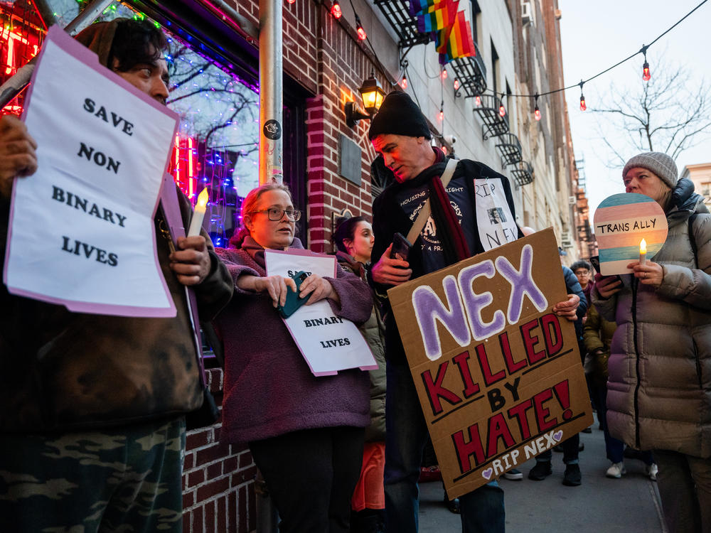 People gather outside the Stonewall Inn on Feb. 26 in New York City for a vigil for Nex Benedict, a 16-year-old who identified as nonbinary.
