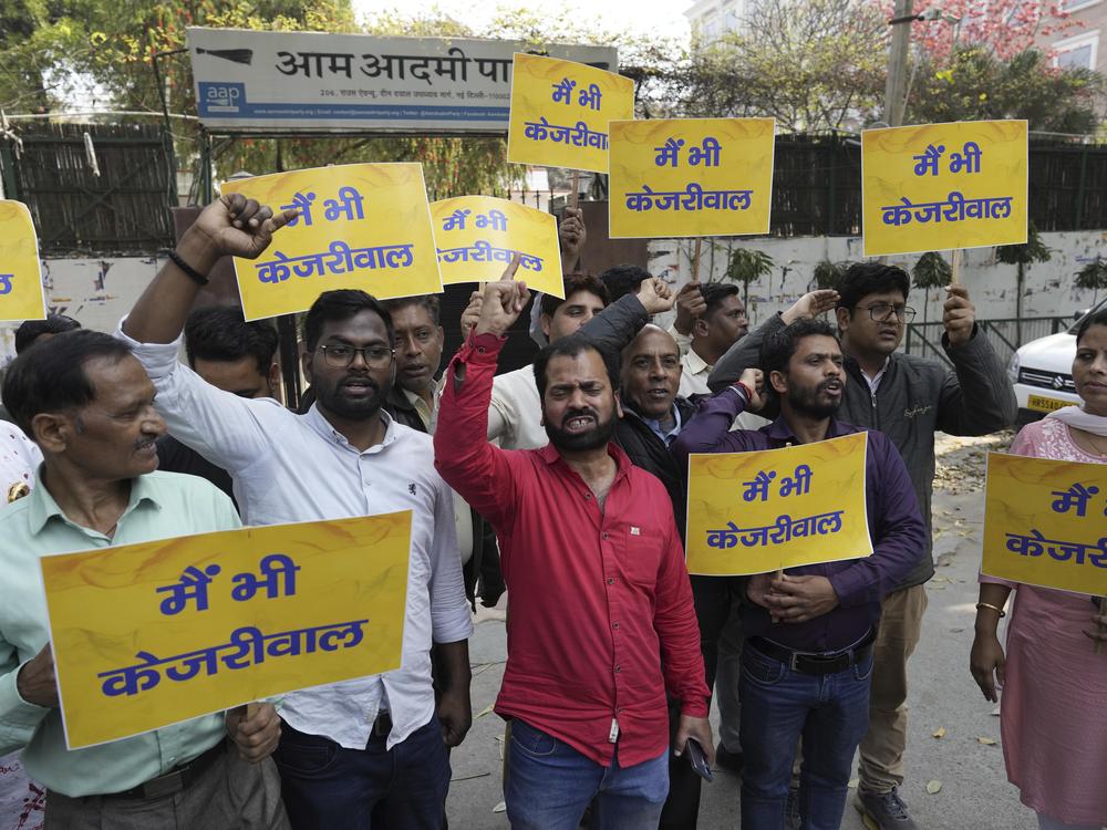 Supporters of the Aam Aadmi Party, or Common Man's Party, shout protest slogans outside the office of India's ruling Bharatiya Janata Party in New Delhi, India, on Friday. Anti-corruption crusader and AAP leader Arvind Kejriwal was arrested Thursday for suspected financial crimes.