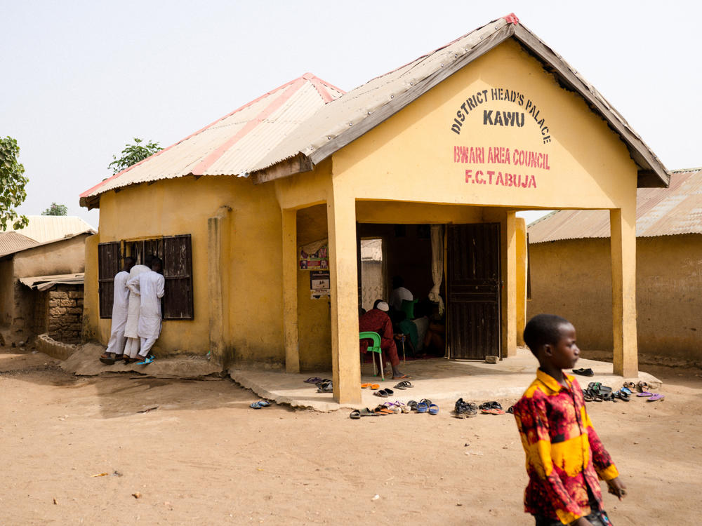 Community members gathered to discuss the events surrounding the kidnappings in their community at The Kawu District Palace which represents the seat of authority in the Kawu (spelled Kau on google maps). All official guests, meetings and pronouncements are made from the Palace.