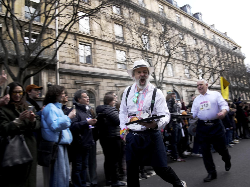 Participants carried trays each with a cup of coffee, a croissant and a glass of water.