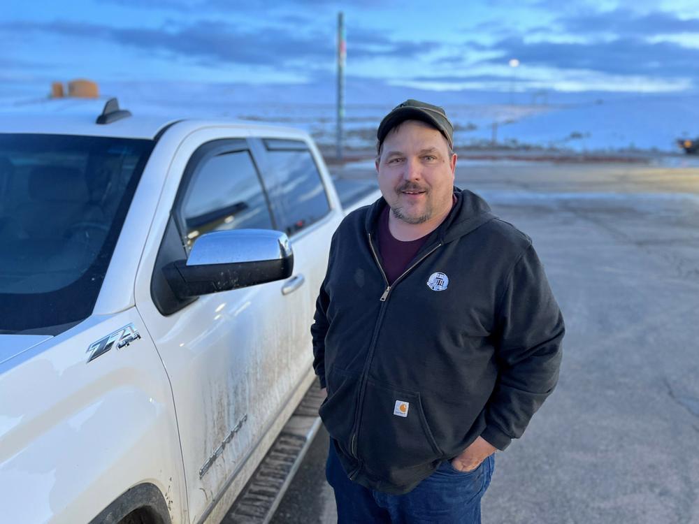 Cliff Green stands by his pickup after a shift at the Kemmerer Coal Mine, where he was grateful to find a new job after being laid off from another nearby mine.