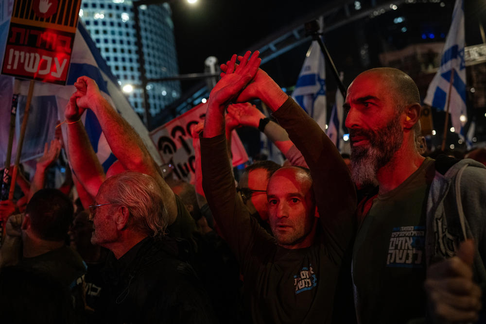 Ron Scherf (second from right) takes part in a protest in Tel Aviv opposing Israeli Prime Minister Benjamin Netanyahu and calling for a deal to release the hostages still held in Gaza, on March 23.