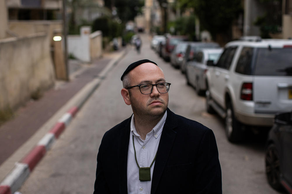 Mordechai Porat, 36, an ultra-Orthodox Jewish man who volunteered for duty last October, stands for a portrait while wearing his dog tags in Bnei Brak on March 21.