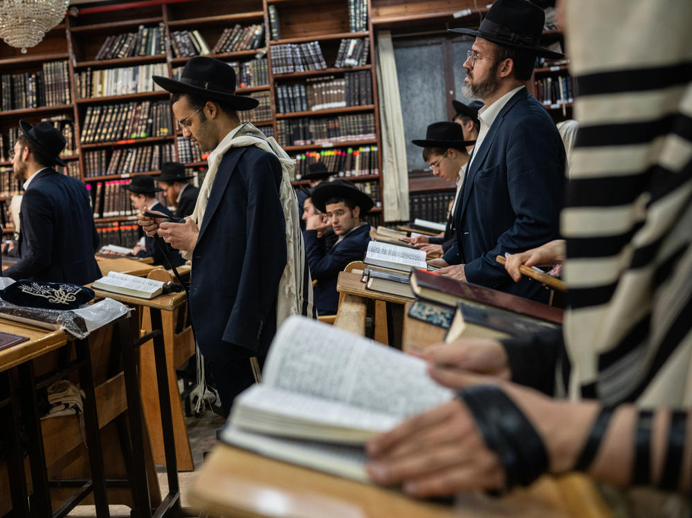 Ultra-Orthodox Jewish men pray at a yeshiva in Bnei Brak, Israel, on March 21. The war in Gaza has prompted calls for Israel to end military exemptions for full-time religious students.