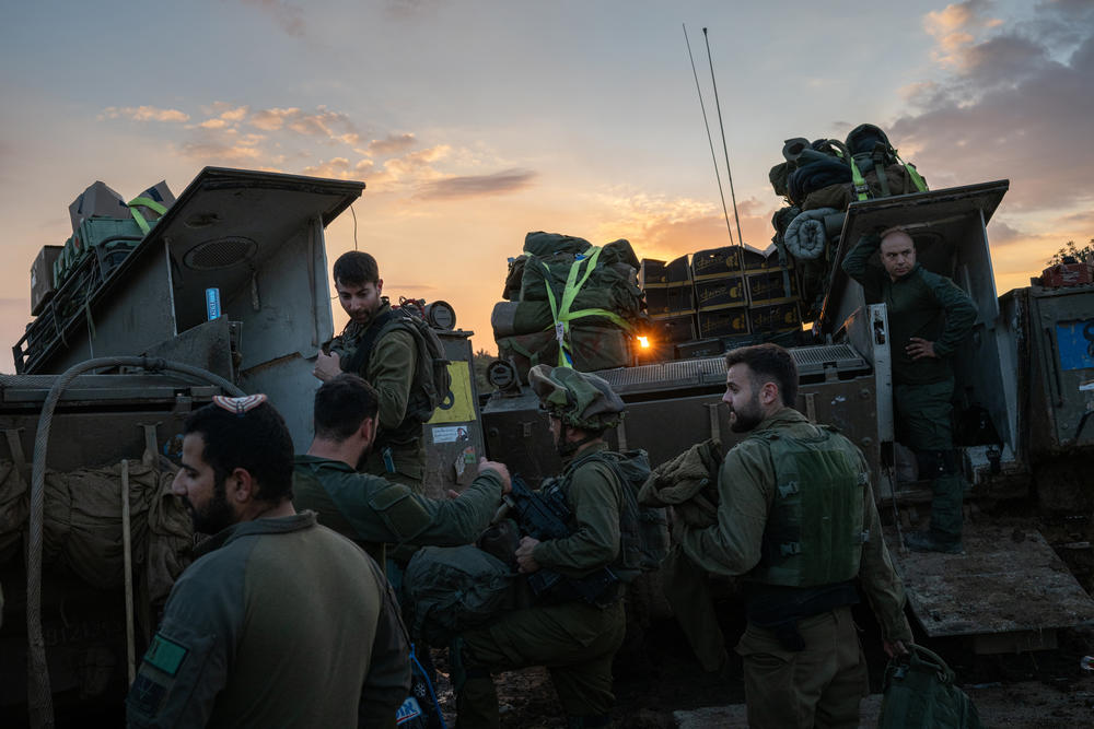 Israeli soldiers gather at a staging area in southern Israel before entering Gaza in December. Israeli Prime Minister Benjamin Netanyahu is supposed to present a military draft plan in coming days that could either extend exemptions for the ultra-Orthodox, or embrace growing calls for change.