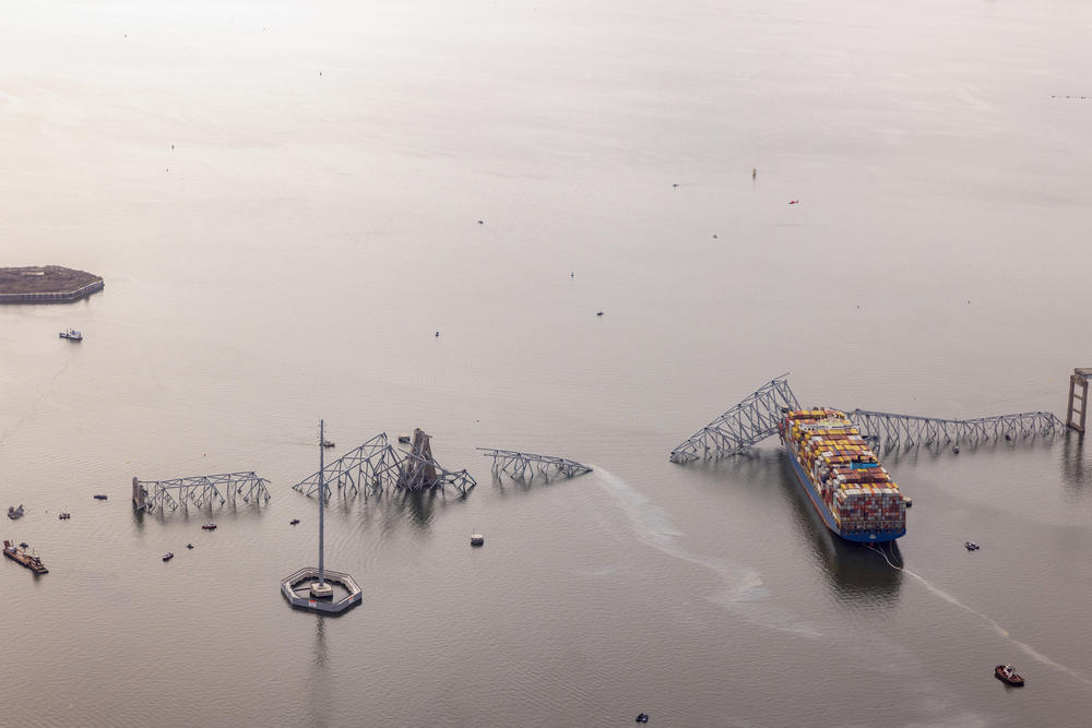In an aerial view, cargo ship Dali is seen after running into and collapsing the Francis Scott Key Bridge.