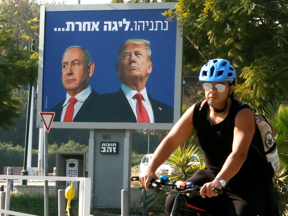 A billboard depicting Israel's Prime Minister Benjamin Netanyahu (L) and former President Donald Trump side by side on a billboard in the Israeli coastal city of Tel Aviv, on January 10, 2021.