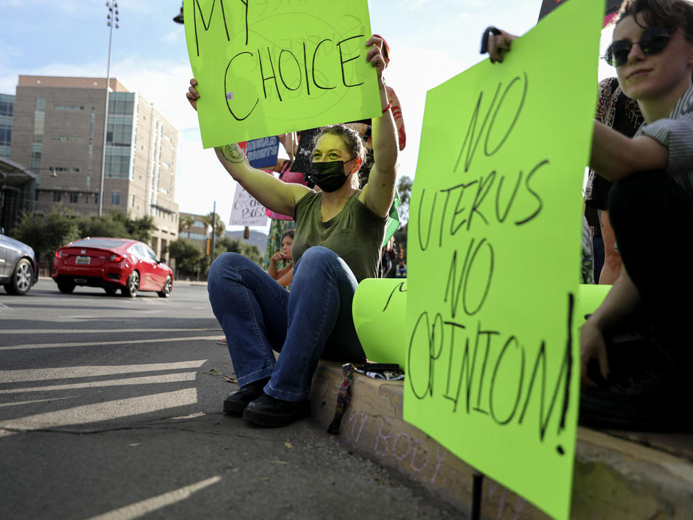 Abortion rights advocates rally at the Tucson Federal Courthouse in 2022. The state Supreme Court is deciding whether a 15-week ban or a near-total ban which dates back to the Civil War should be the state's enforceable abortion law.