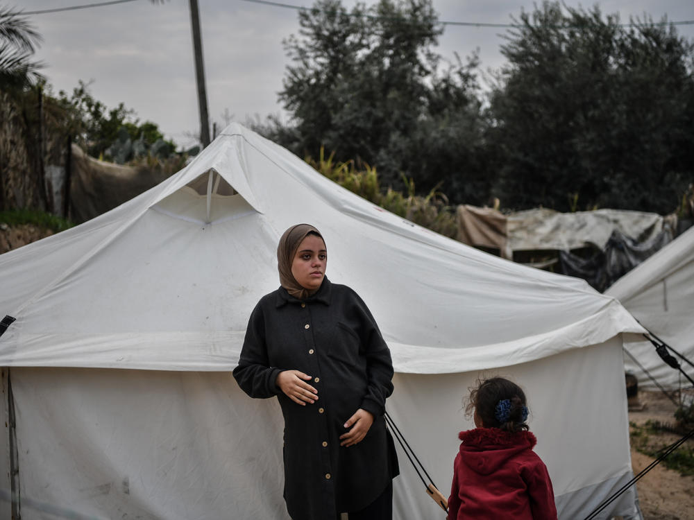 Rua al-Sindavi, 24, expects to give birth in a tent due to insufficient medical facilities, and she had to migrate to Rafah in southern Gaza because of Israeli attacks. Pregnant with triplets, Sindavi is one of many women who suffer from malnutrition due to food shortages in the city.