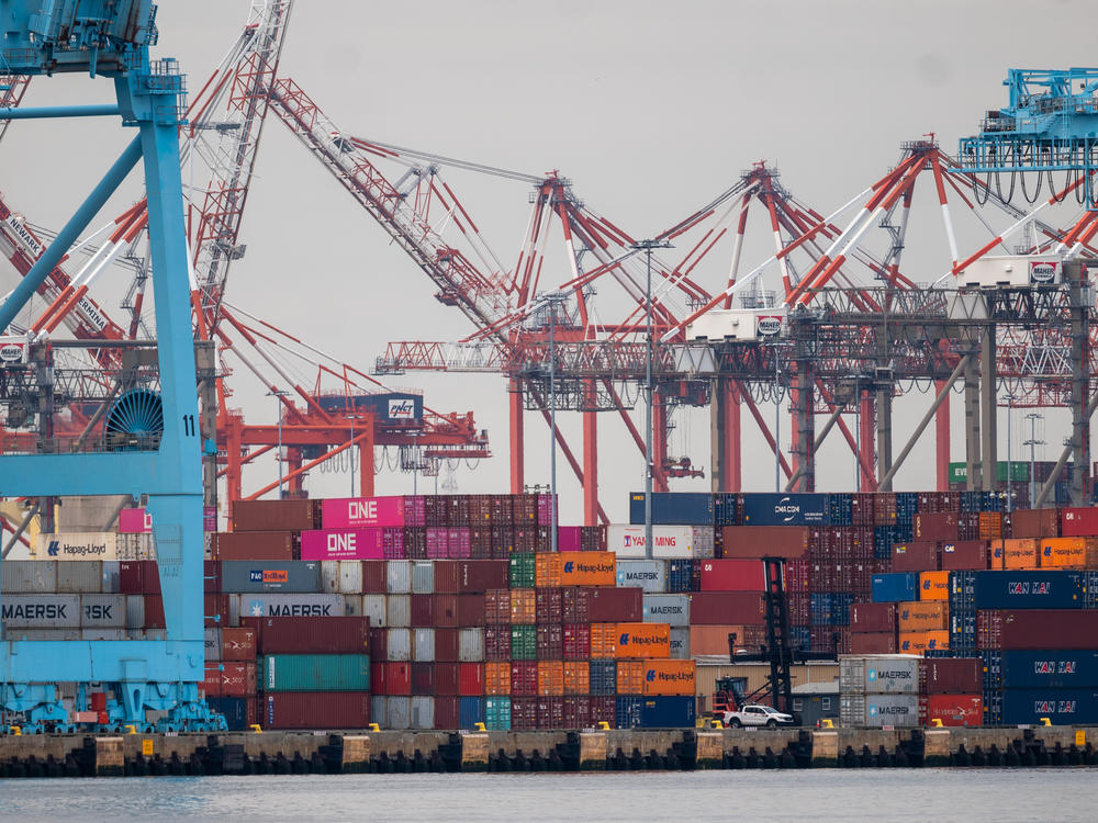 Cranes stand over shipping containers at the Port of Newark on Tuesday as seen from Bayonne, N.J. Supply chains at ports up and down the East Coast are expected to be affected after a cargo ship hit and collapsed the Francis Scott Key Bridge in Baltimore.