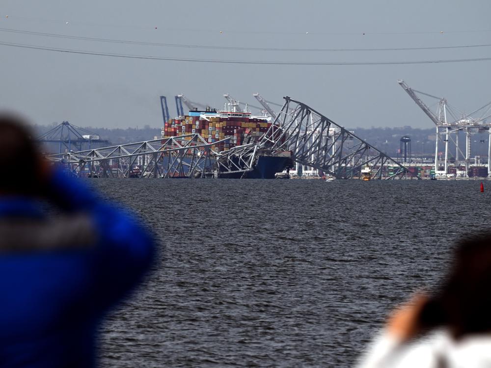 Francis Scott Key Bridge collapsed after being hit by the Dali container vessel sending vehicles into the Patapsco River as viewed from Riviera Beach MD on March 26, 2024.