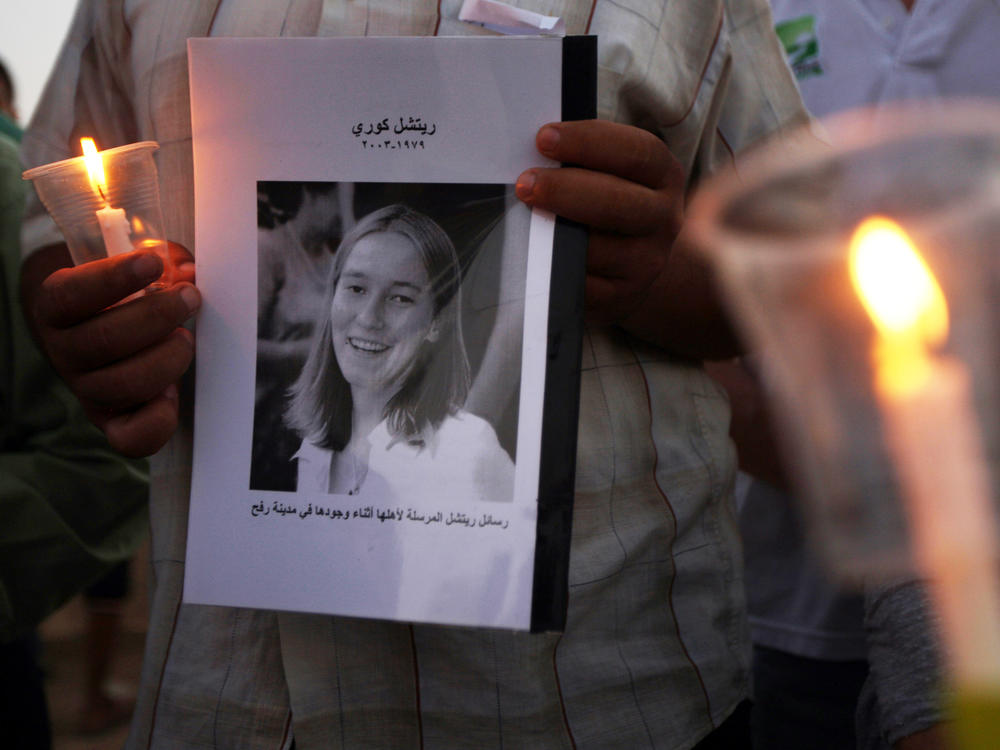 Palestinian children hold candles during a rally at a refugee camp in Rafah, in the southern Gaza Strip, in 2012, in memory of Rachel Corrie.