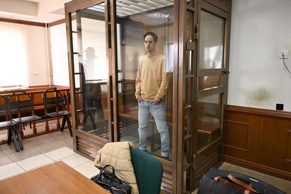 Evan Gershkovich stands inside a defendants' cage before a hearing to consider an appeal on his extended pretrial detention at the Moscow City Court on Sept. 19, 2023.