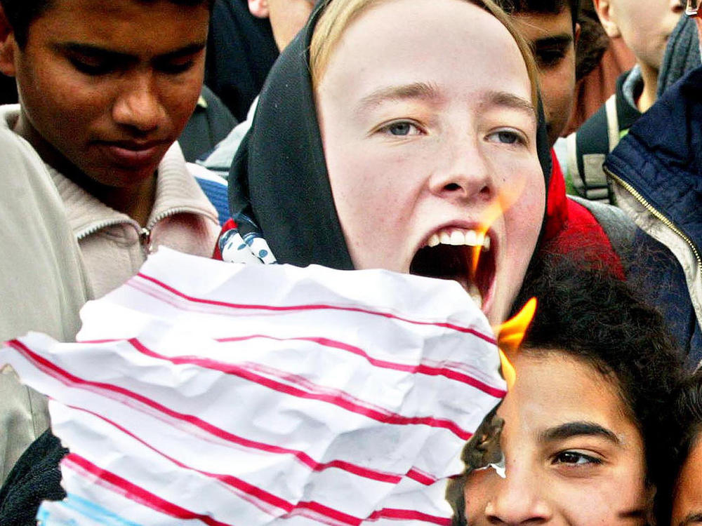 American activist Rachel Corrie, 23, shouts during an anti-war, pro-Iraq rally by Palestinians and foreign activists in February 2003 in the Rafah refugee camp in the Gaza Strip.