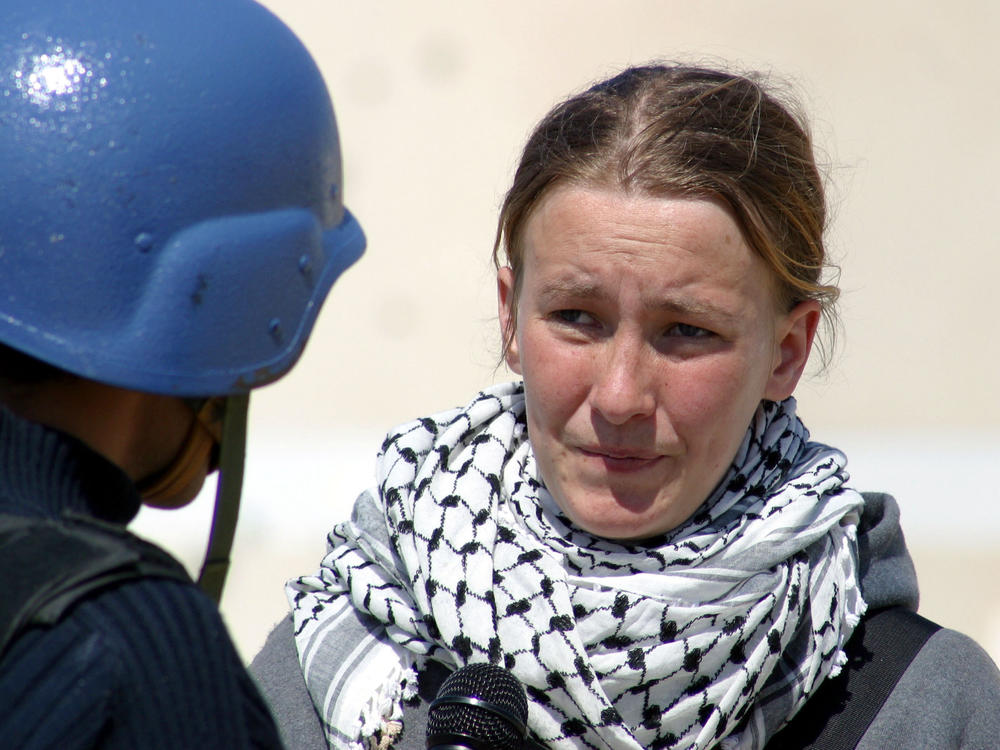 American peace activist Rachel Corrie speaks during an interview with Middle East Broadcasting on March 14, 2003, in Rafah, two days before she was run over and killed by an Israeli bulldozer when she tried to stop it from destroying a Palestinian house. Corrie was a member of the International Solidarity Movement.