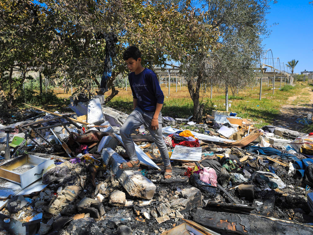 Palestinians inspect the debris of the houses destroyed by Israeli bombardment in Rafah in the southern Gaza Strip on March 11.