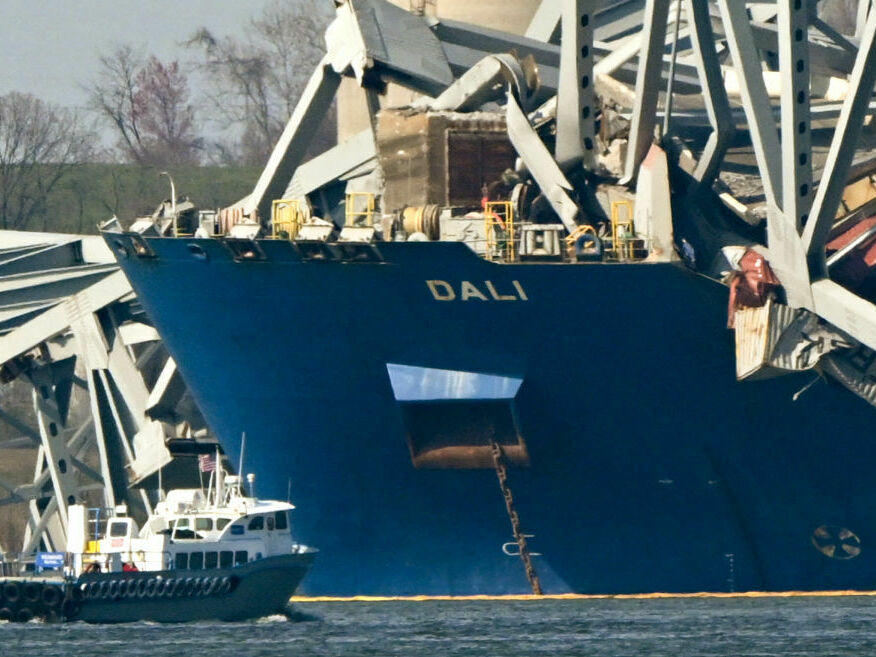 The wreckage of the collapsed Francis Scott Key Bridge lies on top of the container ship Dali in Baltimore on Friday.