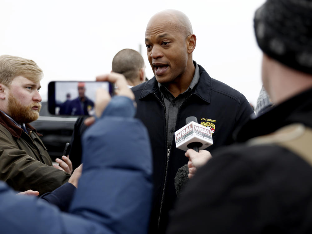 Maryland Gov. Wes Moore speaks to reporters near the collapsed Francis Scott Key Bridge on March 27, 2024 in Baltimore, Md.