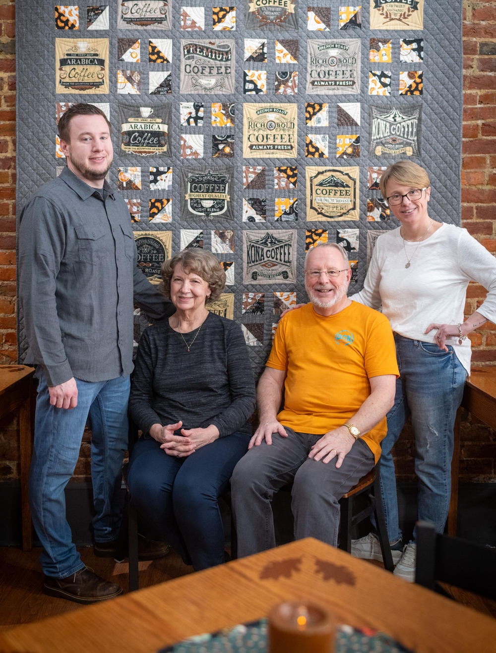 Sibling Coffee Roasters is a family affair; brother Benjamin Withem will stop by to indulge in a cold brew and chat with mother Naysa Withem, father Michael Withem, and sister and owner Libby Powell. Here, they pose in front of a quilt Naysa made for the shop.