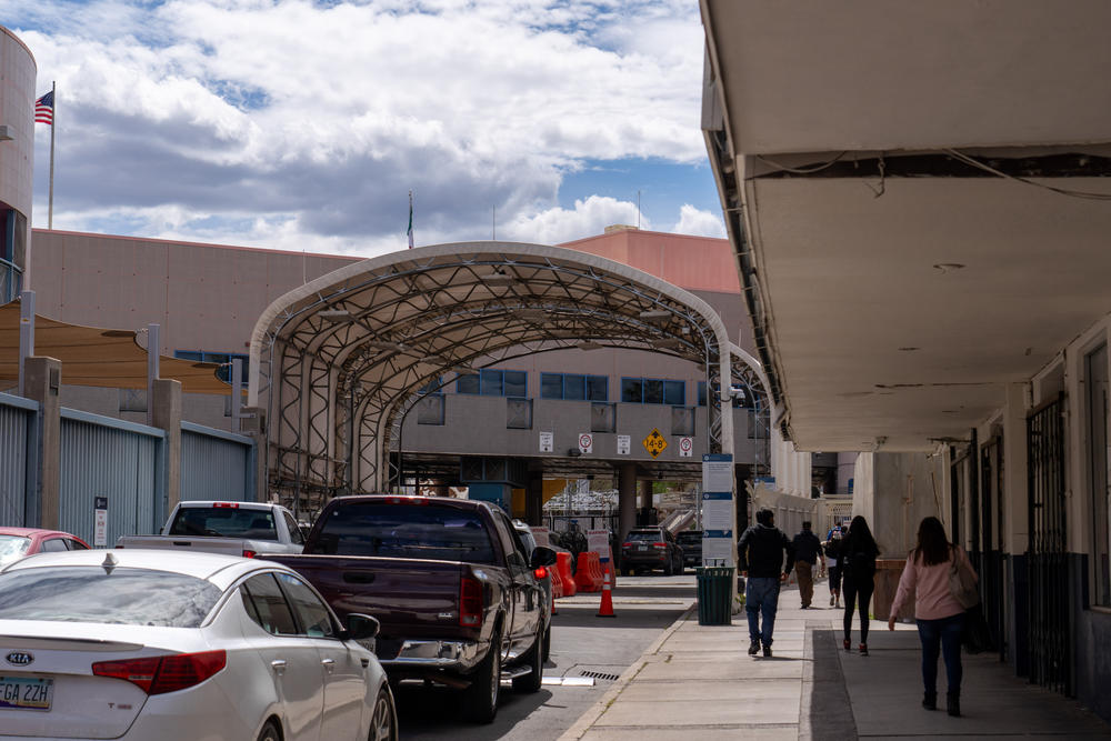 People drive and walk across the border through the Nogales port of entry in Arizona.