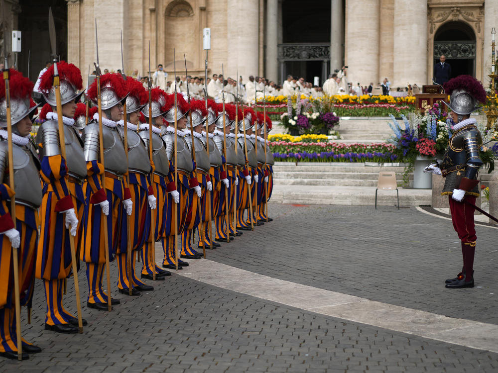 Vatican Swiss Guards take position in St. Peter's Square at The Vatican where Pope Francis will celebrate the Easter Sunday mass, Sunday, March 31, 2024.