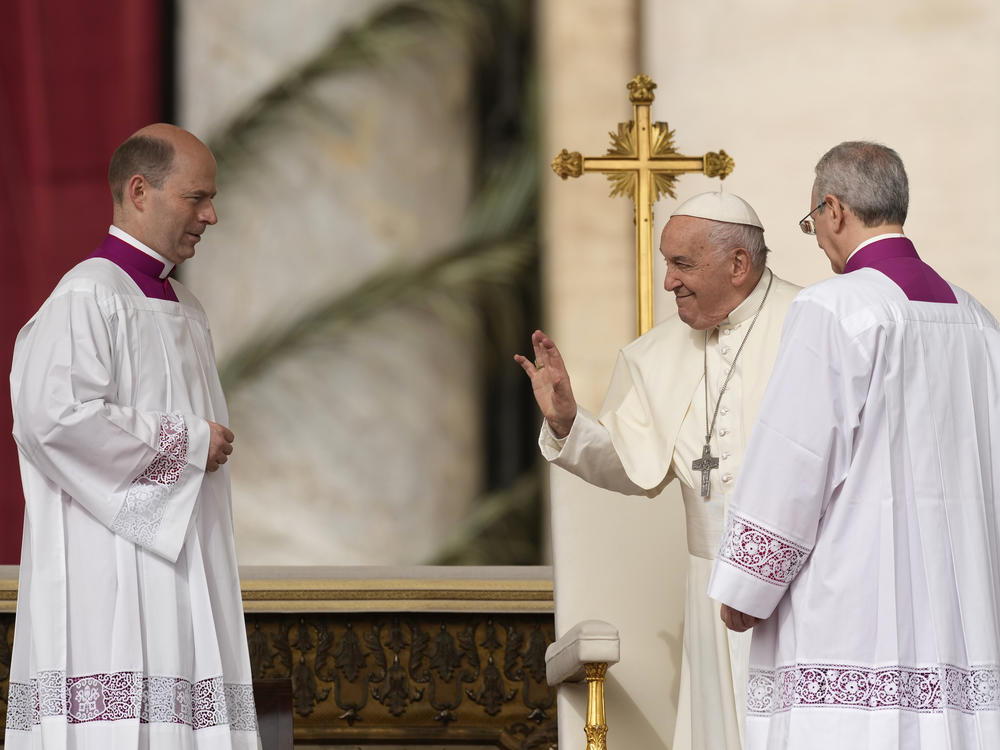 Pope Francis arrives as he celebrates Easter mass in St. Peter's Square at the Vatican, Sunday, March 31, 2024.