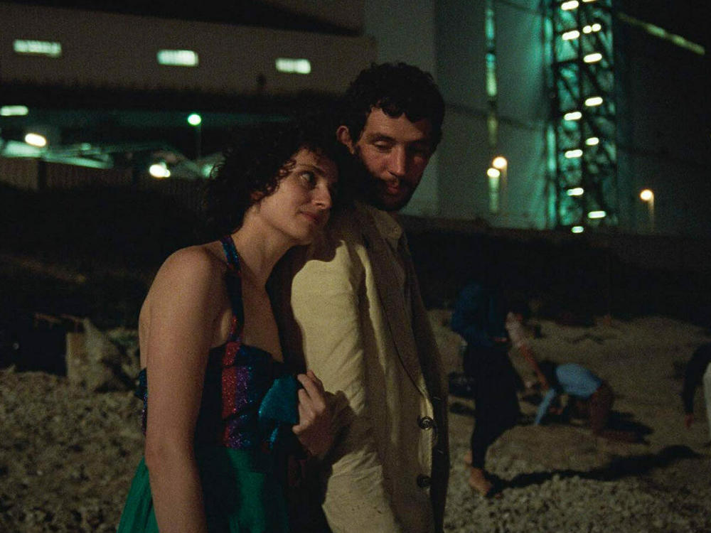 Carol Duarte and Josh O'Connor in <em>La Chimera</em>.