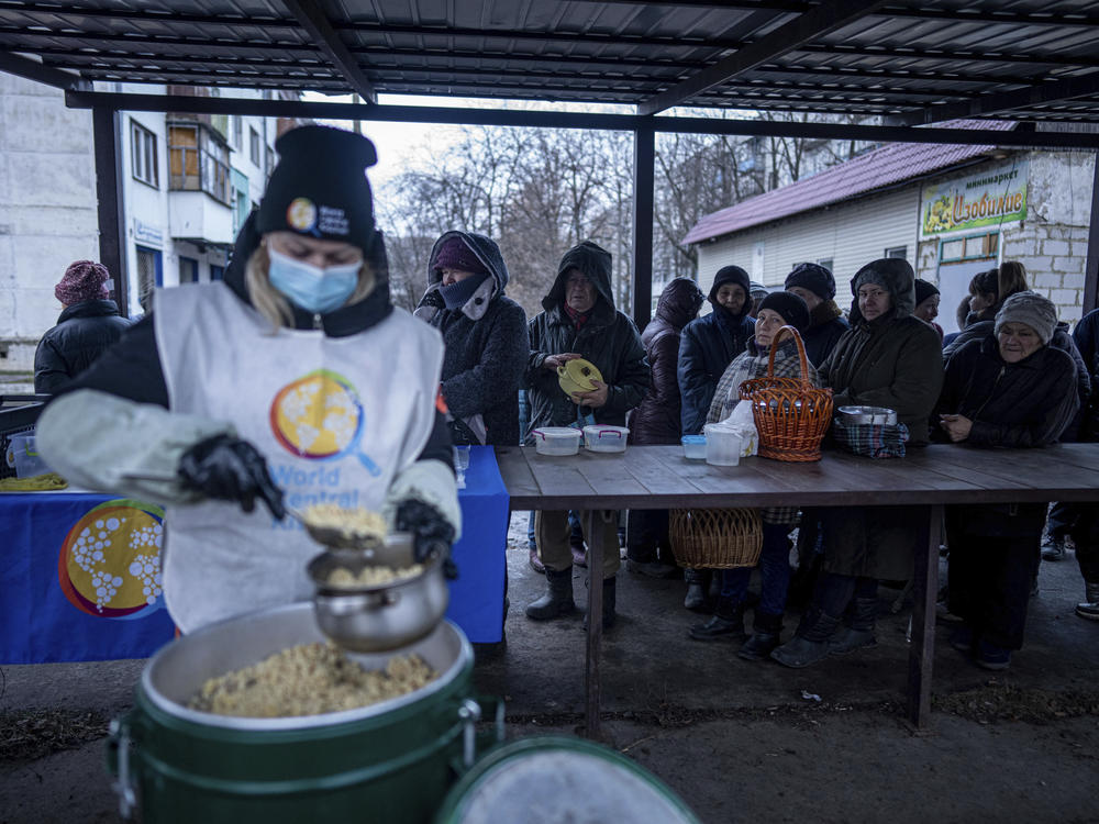 People line up for food prepared by a World Central Kitchen worker in Kupiansk in the Kharkiv region of Ukraine in December 2022.
