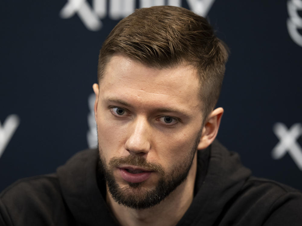 Philadelphia Flyers' Ivan Fedotov takes questions from the media during an NHL hockey press conference, Friday, March 29, 2024, in Voorhees, N.J. Nine years after he was drafted by Philadelphia, goalie Ivan Fedotov has joined the Flyers.